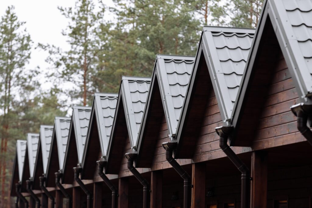 Row Of Roofs With Green Metal Tile Of Wooden House Utc