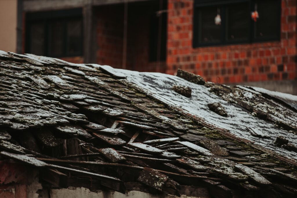 Shot Of An Old Broken Roof Covered In Snow On The Utc