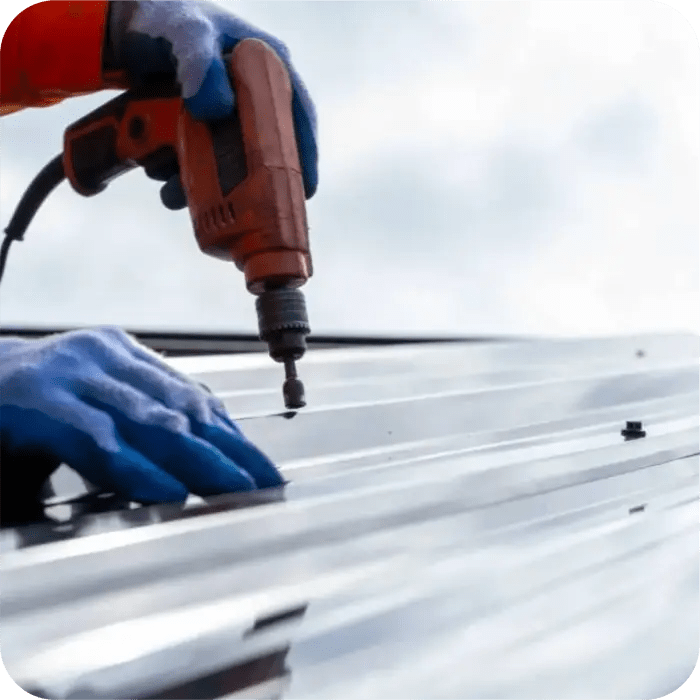 Someone's getting down to business fixing' or installing' a metal roof