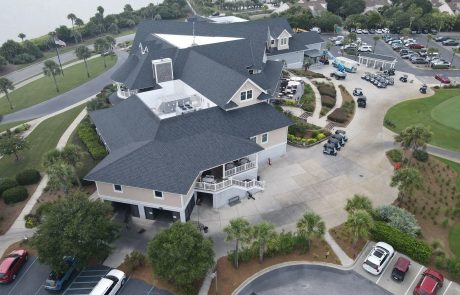 A building surrounded by a golf course and some nice landscaping